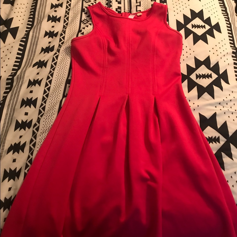 Hot pink pleated dress that sinches the waist.