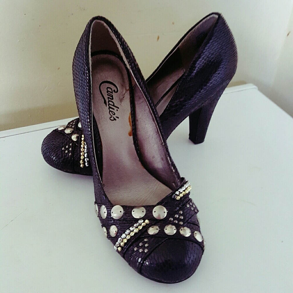 Candies black studded snakeskin pumps.