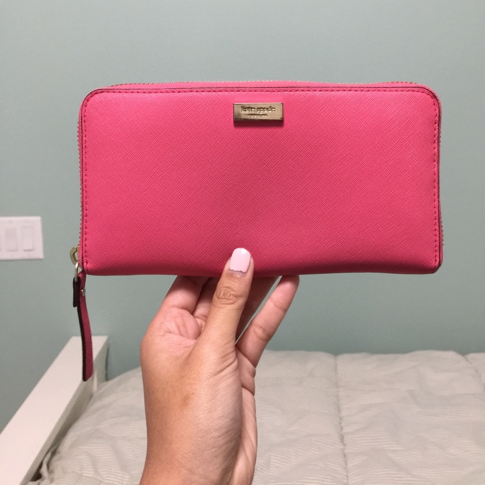 Kate Spade pink "Newbury Lane" zip around wallet.