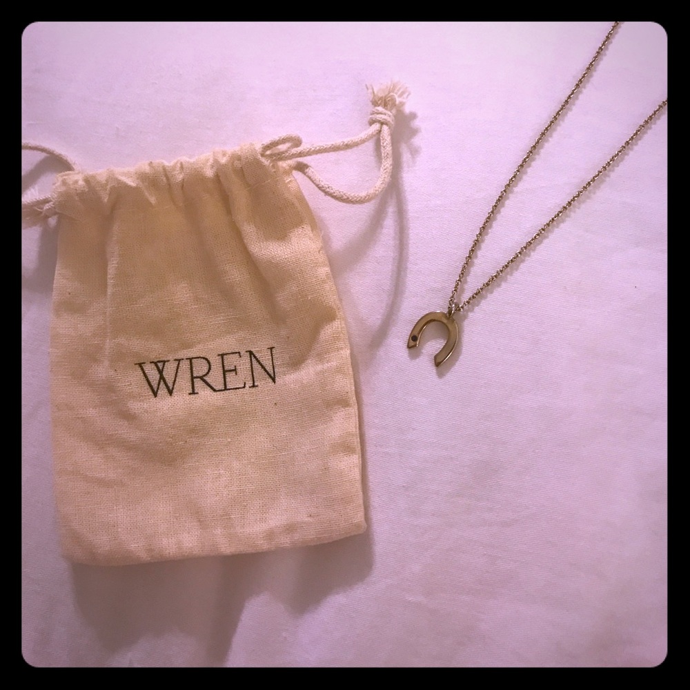 14k Wren gold horseshoe necklace.
