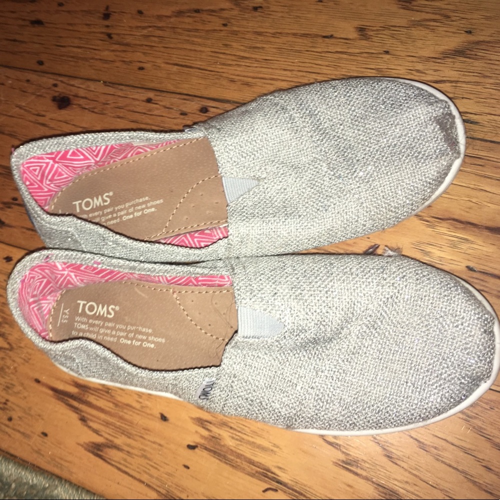 Silver slip on Toms