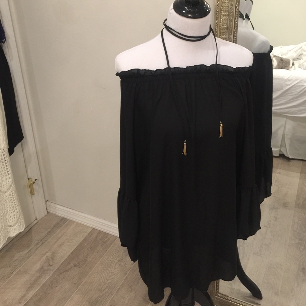 Black off the shoulder shift dress.