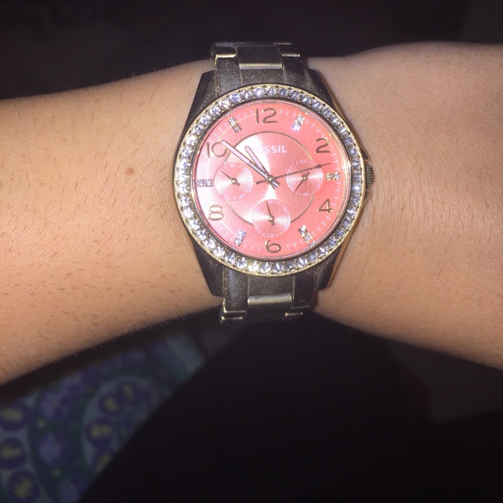 Orange and gold fossil watch