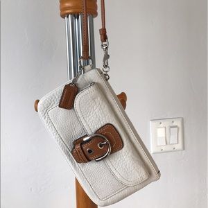 White and Brown Coach Wristlet
