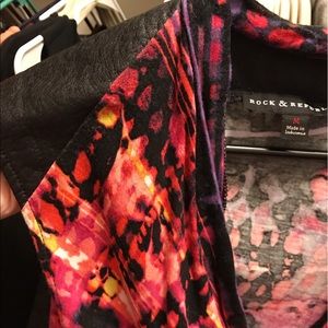 Colorful top with faux leather shoulders and back