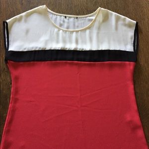 Cap-sleeve red, cream, and black blouse