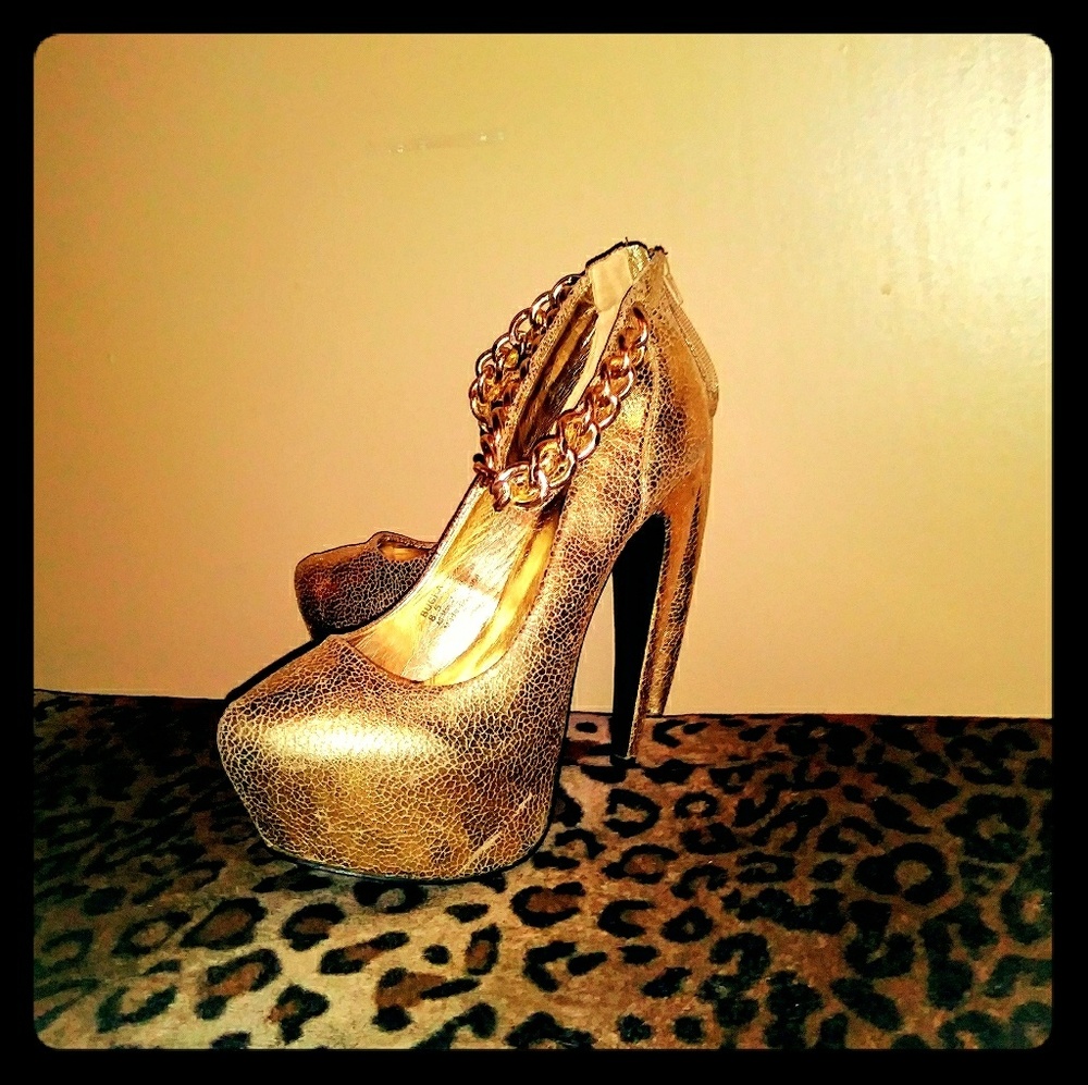 Unique gold platform pumps with gold chain strap