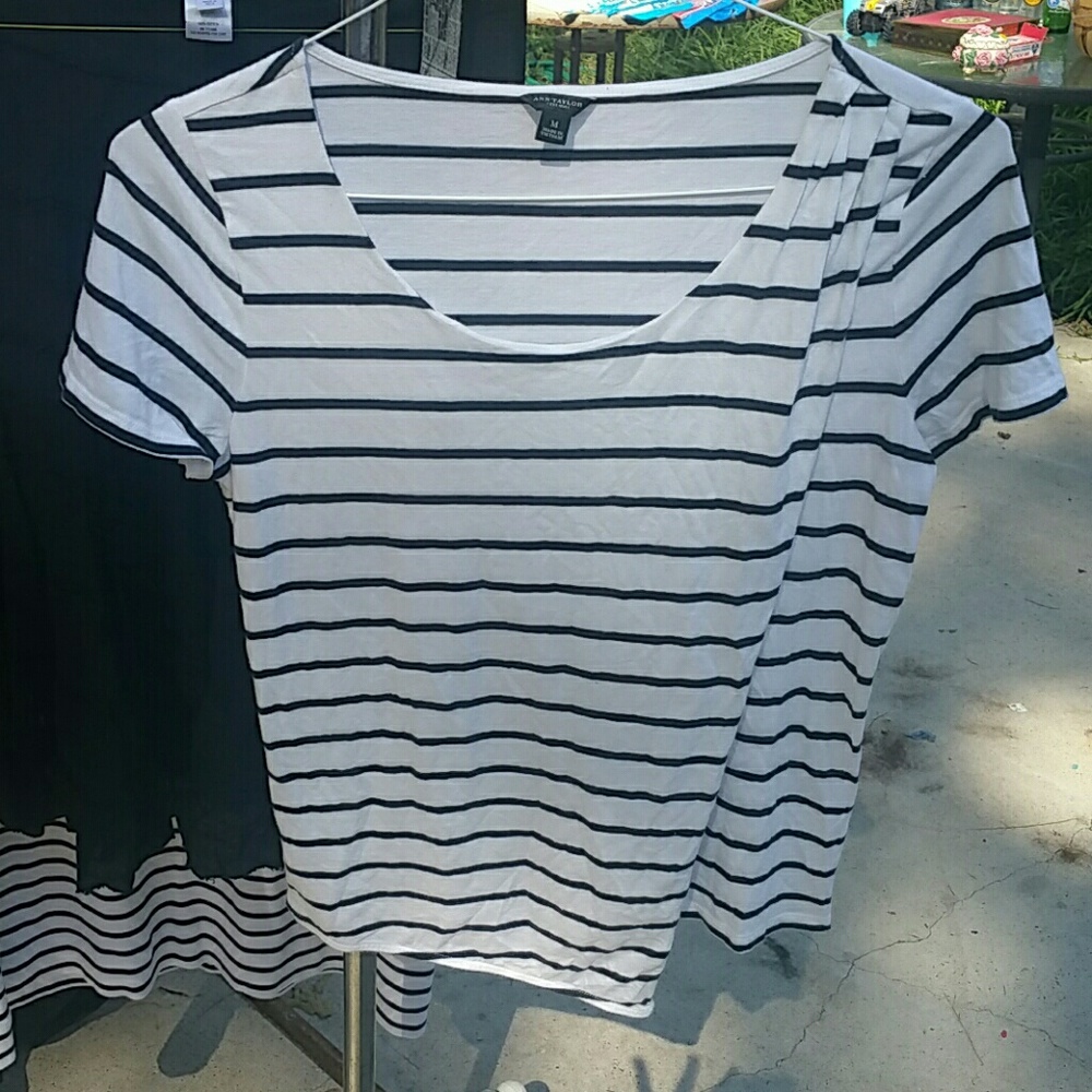 T shirt. White with black stripes