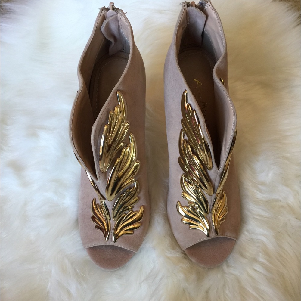 Gold wing high heels!