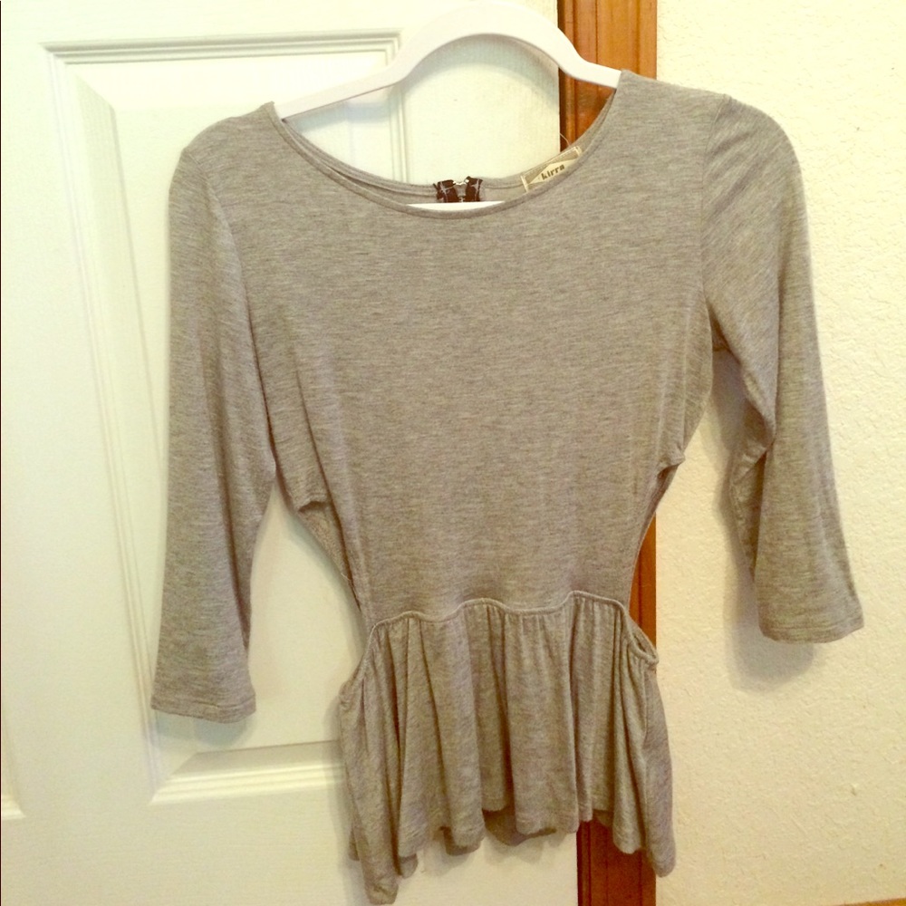 Peplum top with side cut outs