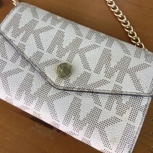 Michael Kors cross body wallet on a chain