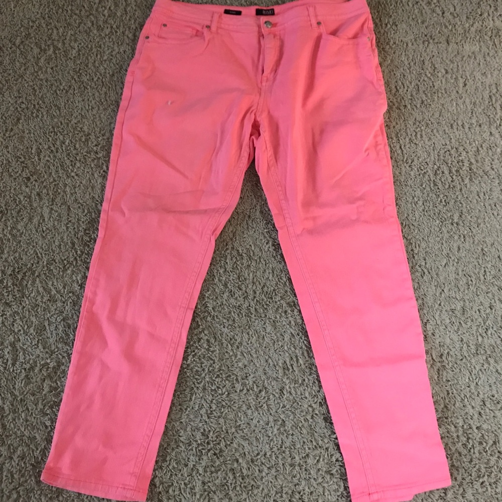 Melon colored skinny jeans.
