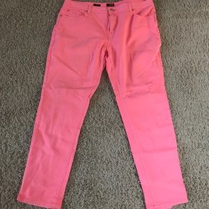 Melon colored skinny jeans.