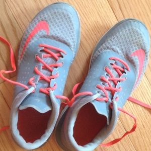 Pink and grey Nike running shoes