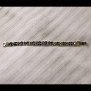 Silver tone with blue crystals bracelet. 7.5in