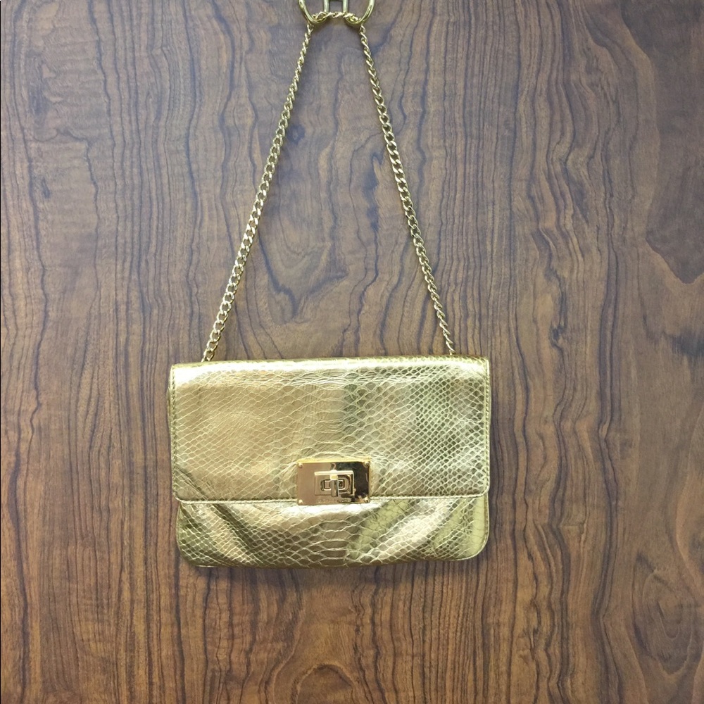 Micheal Kors Gold clutch/shoulder bag.