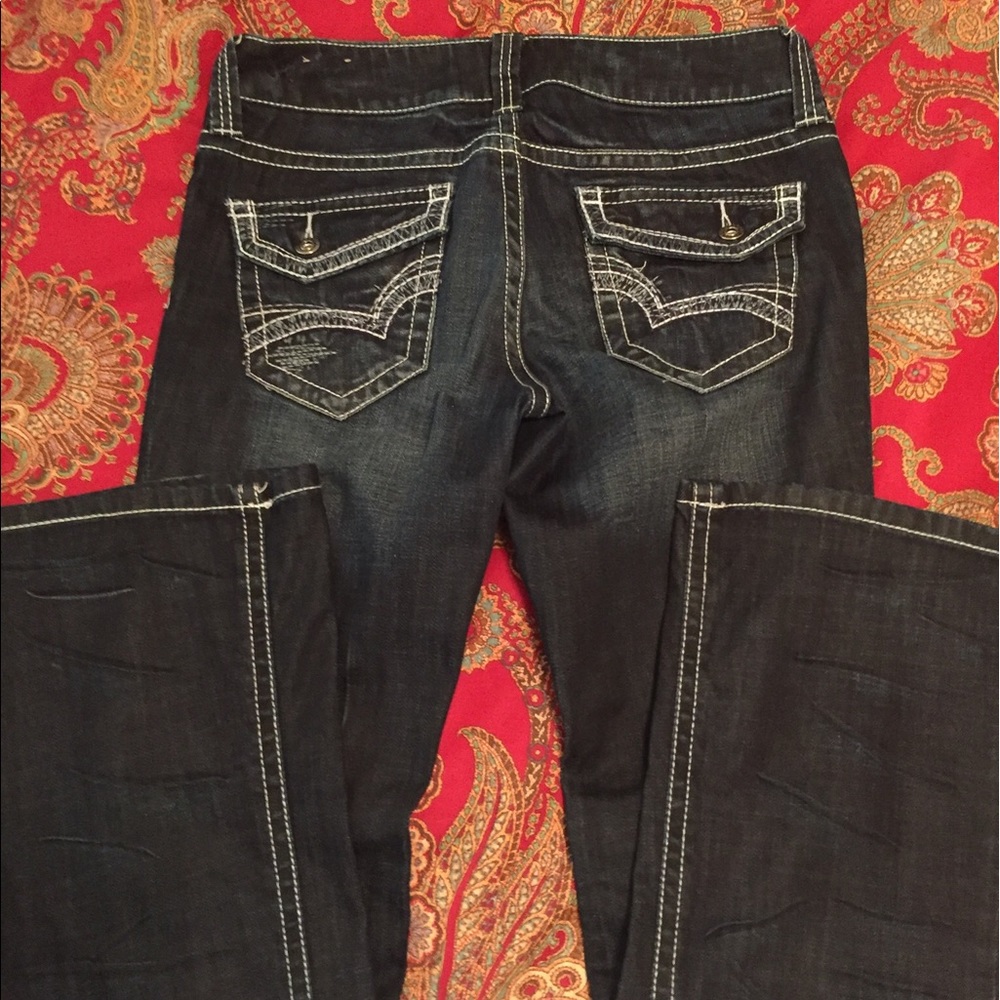 Distressed dark jeans