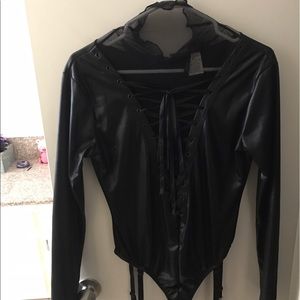Black pleather body suit.