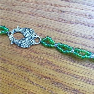 Beaded bracelet with fish charm