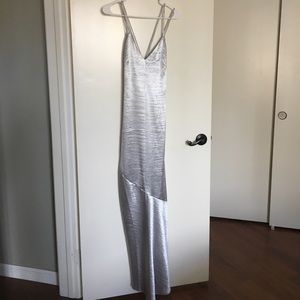 Floor length, fitted silver evening gown