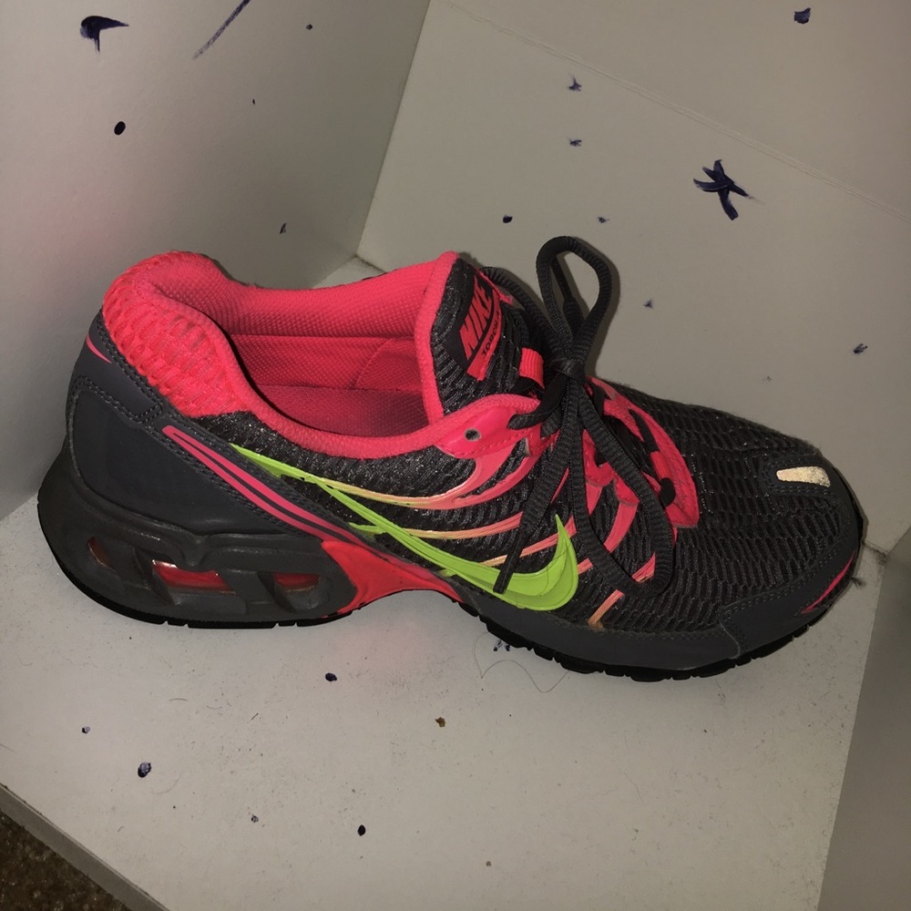 grey pink and yellow nike running sneakers.