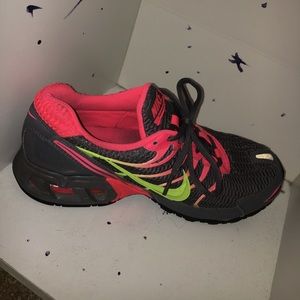 grey pink and yellow nike running sneakers.