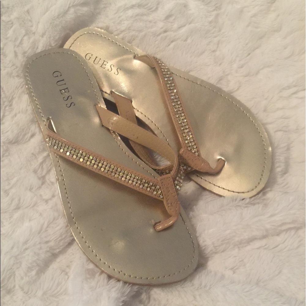 Guess gold flip flops
