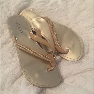 Guess gold flip flops