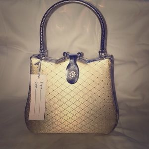 Small dressy clutch with handle