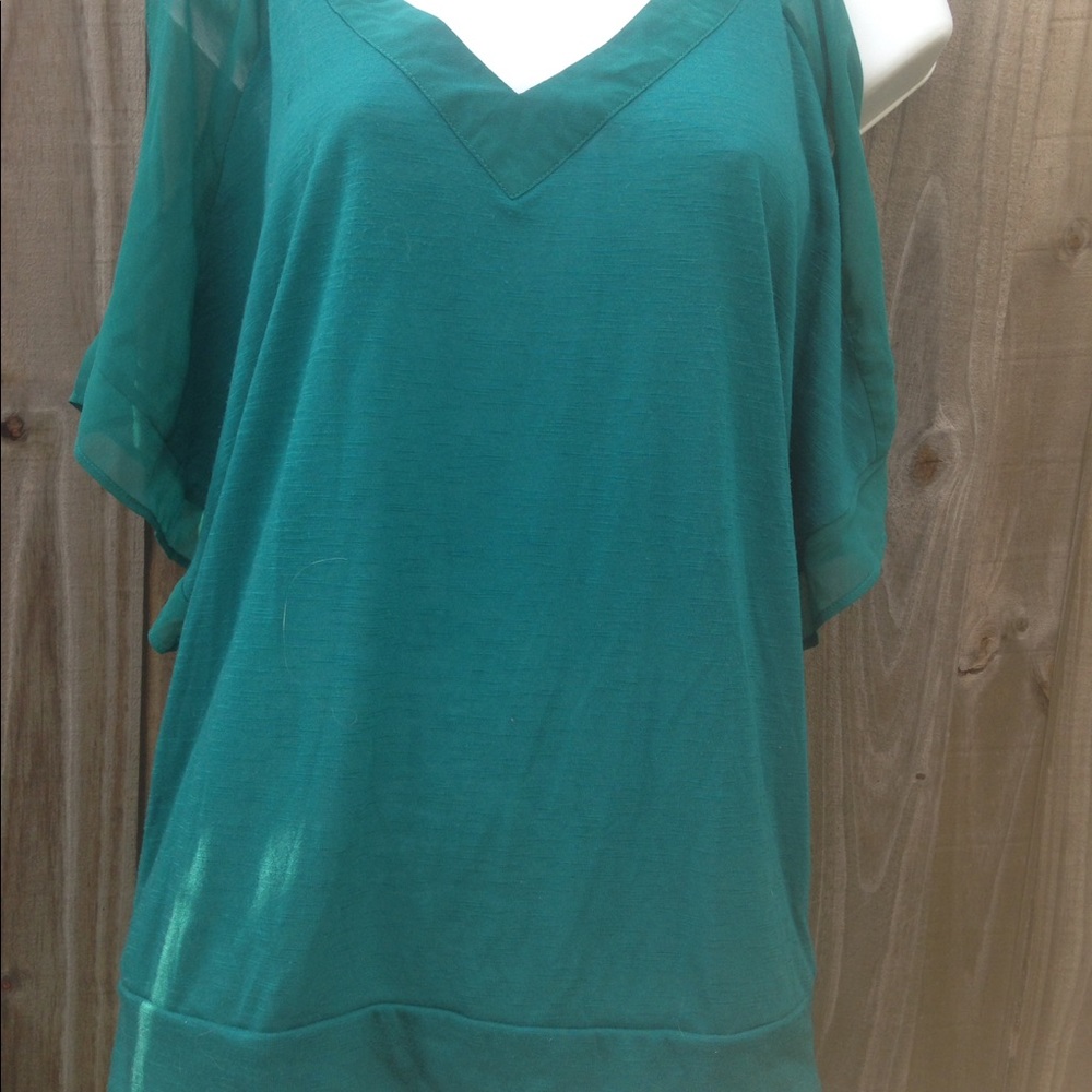 Awesome green shirt made by Dots. Size medium.