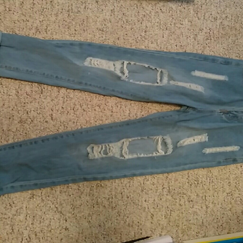 Artificially ripped blue boyfriend jeans