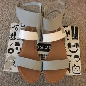 Grey and white unworn sandals
