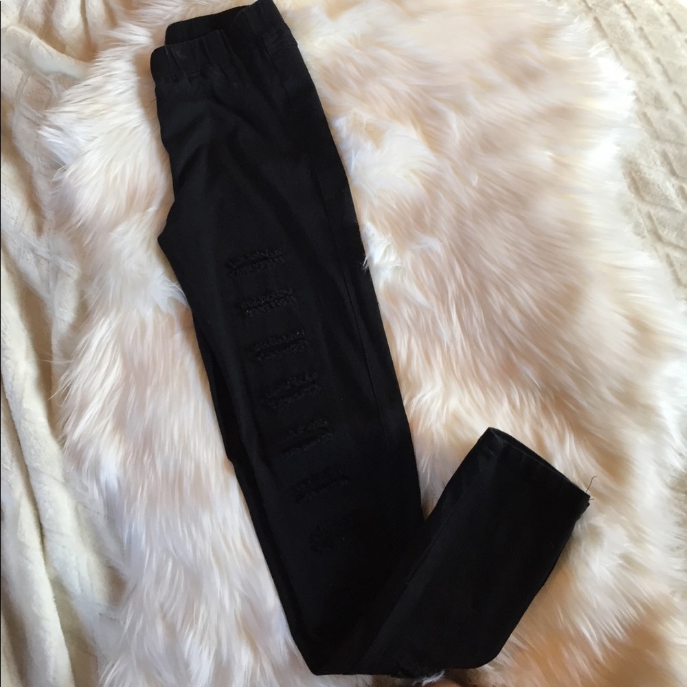 Distressed black jeggings