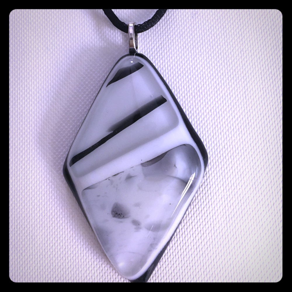 Artistic black and white glass pendant on silk