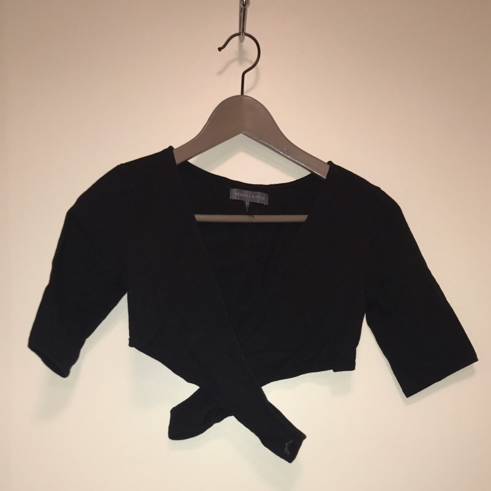 Kendall and Kylie crop criss cross sweater.