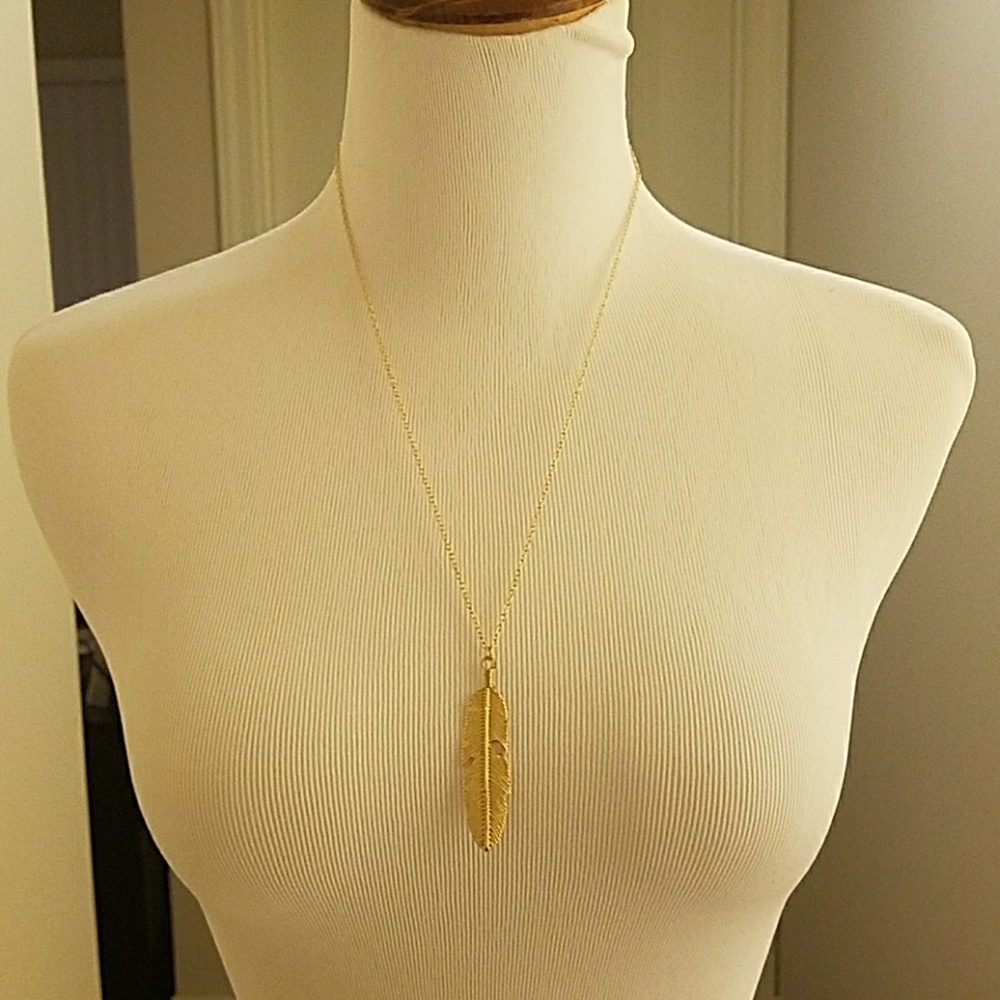 Gold single feather necklace