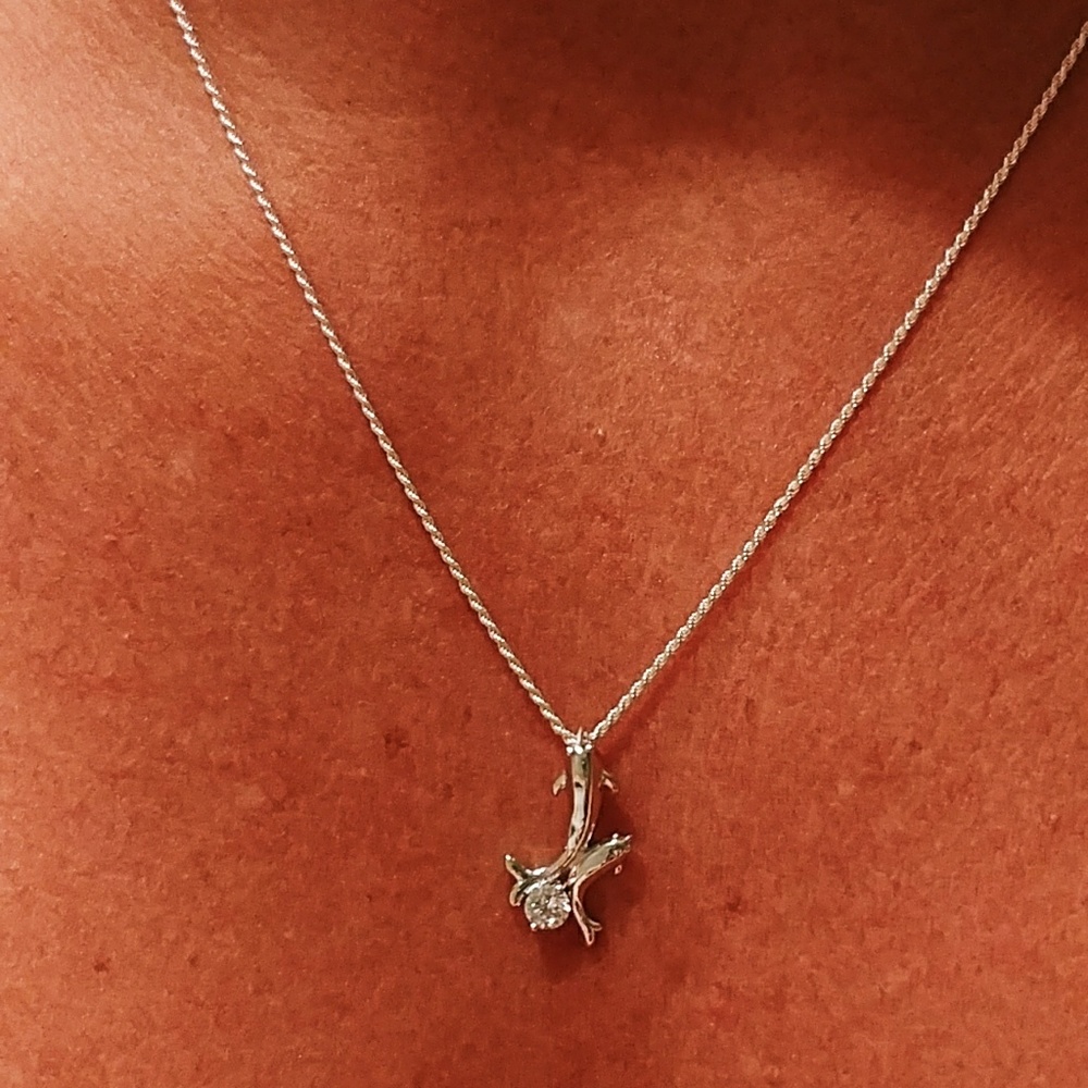 Platinum Dolphins charm on chain