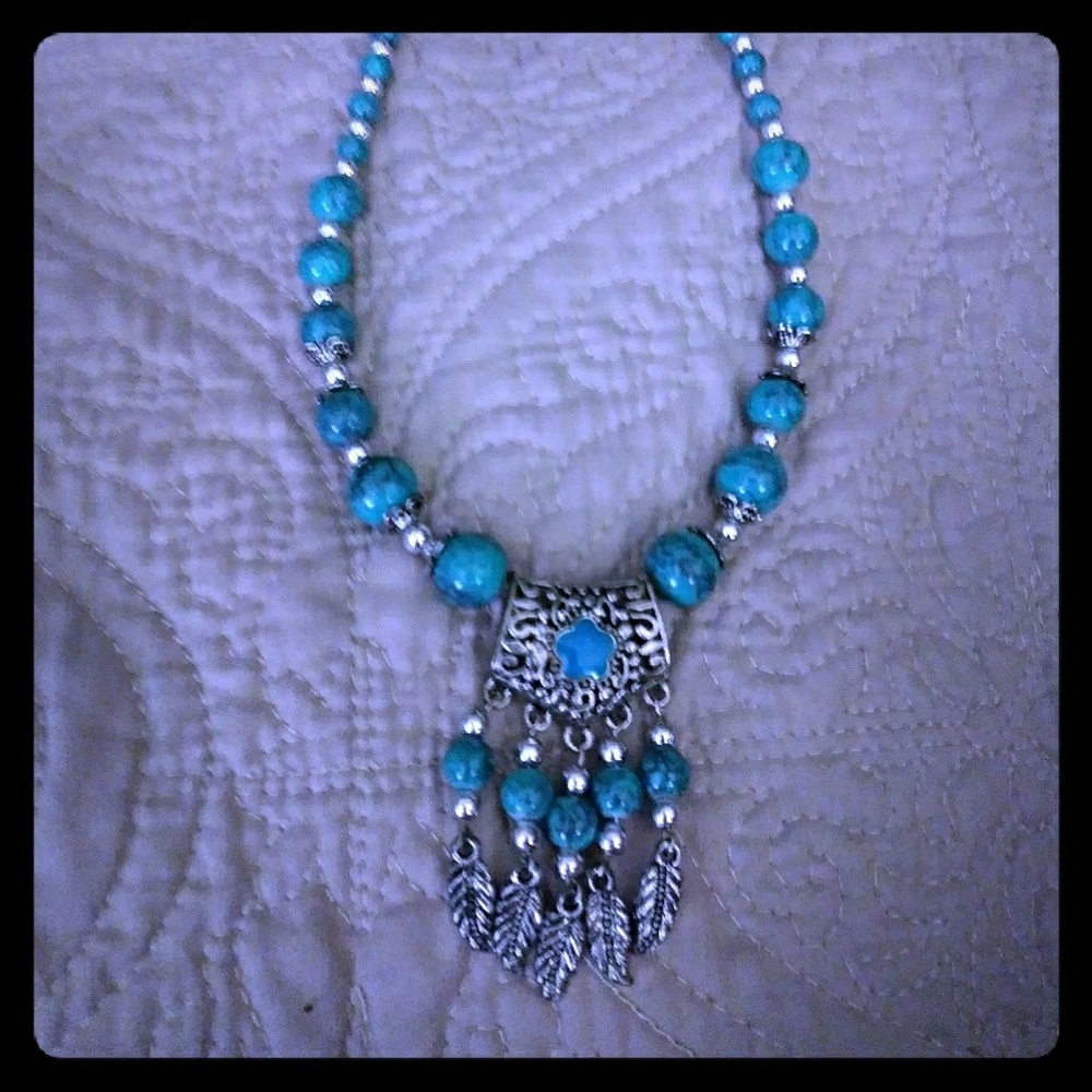 Turquoise stones and silver feathers necklace