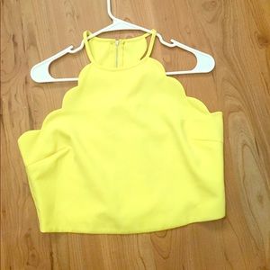 Scalloped yellow crop top.