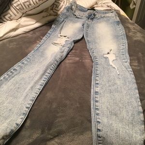 Acid wash lightly distressed denim skinny jeans