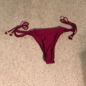 a maroon bathing suit bottom