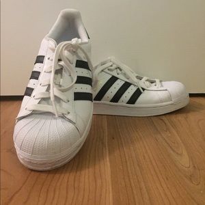 Adidas superstar shoes.