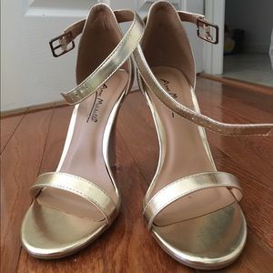 Metallic gold strapped heels