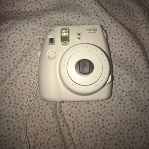 White Polaroid with accessories