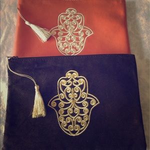 Embroidered Moroccan khamssa clutches.