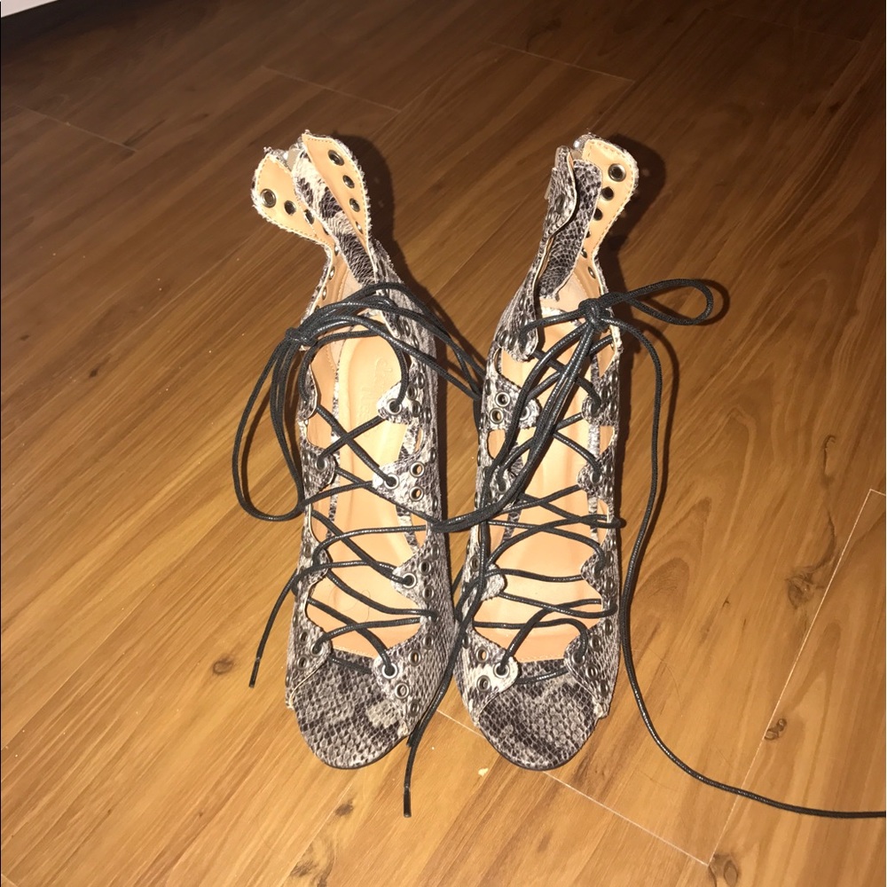 Lace up snakeskin heels