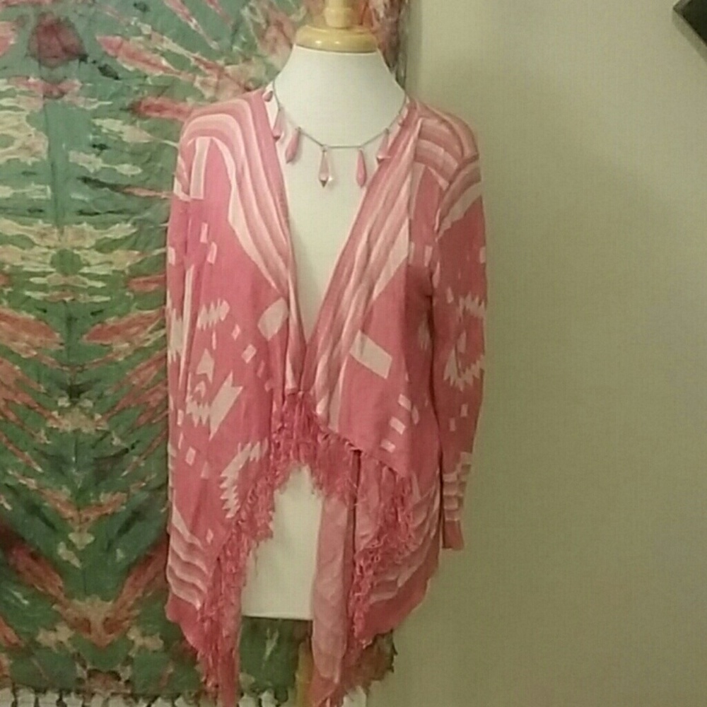 Long sleeved cardigan with fringe.