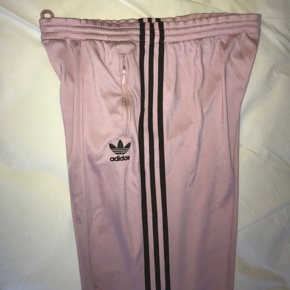 Pink Adidas pants with brown stripes