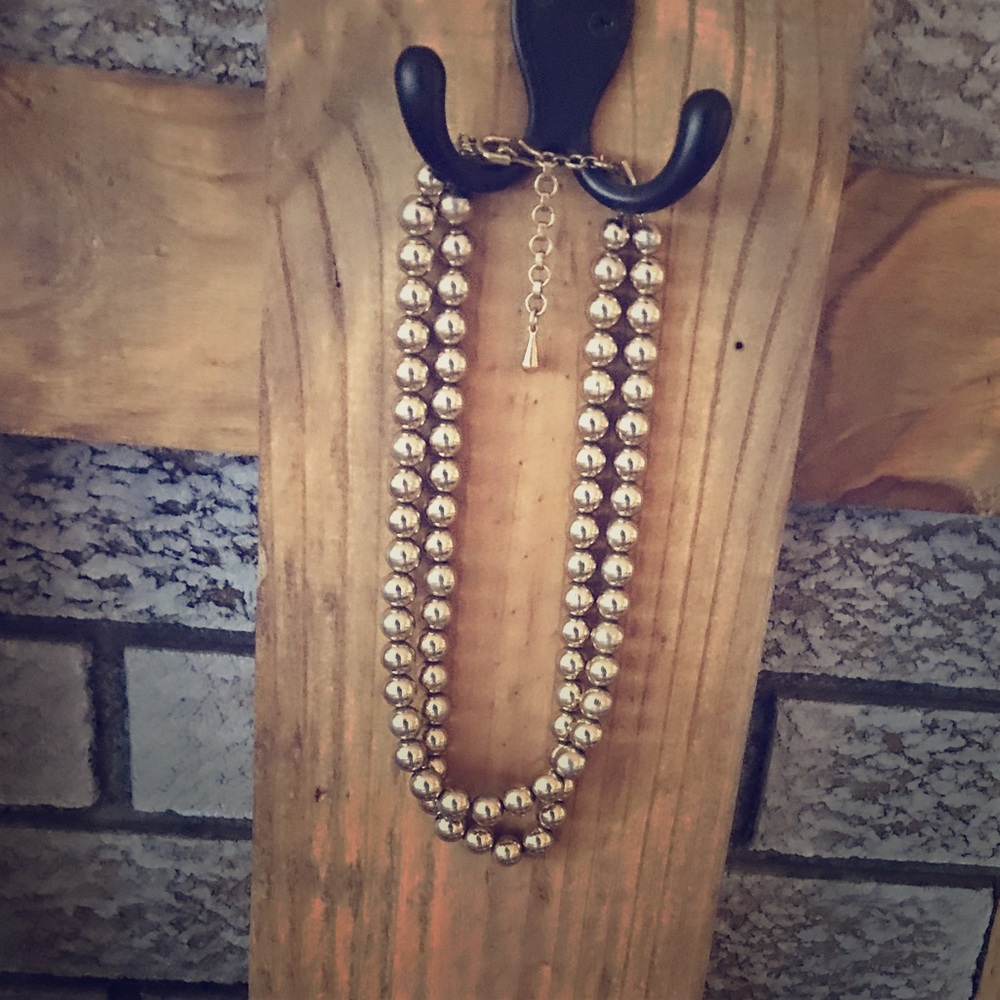 Gold colored pearl necklace
