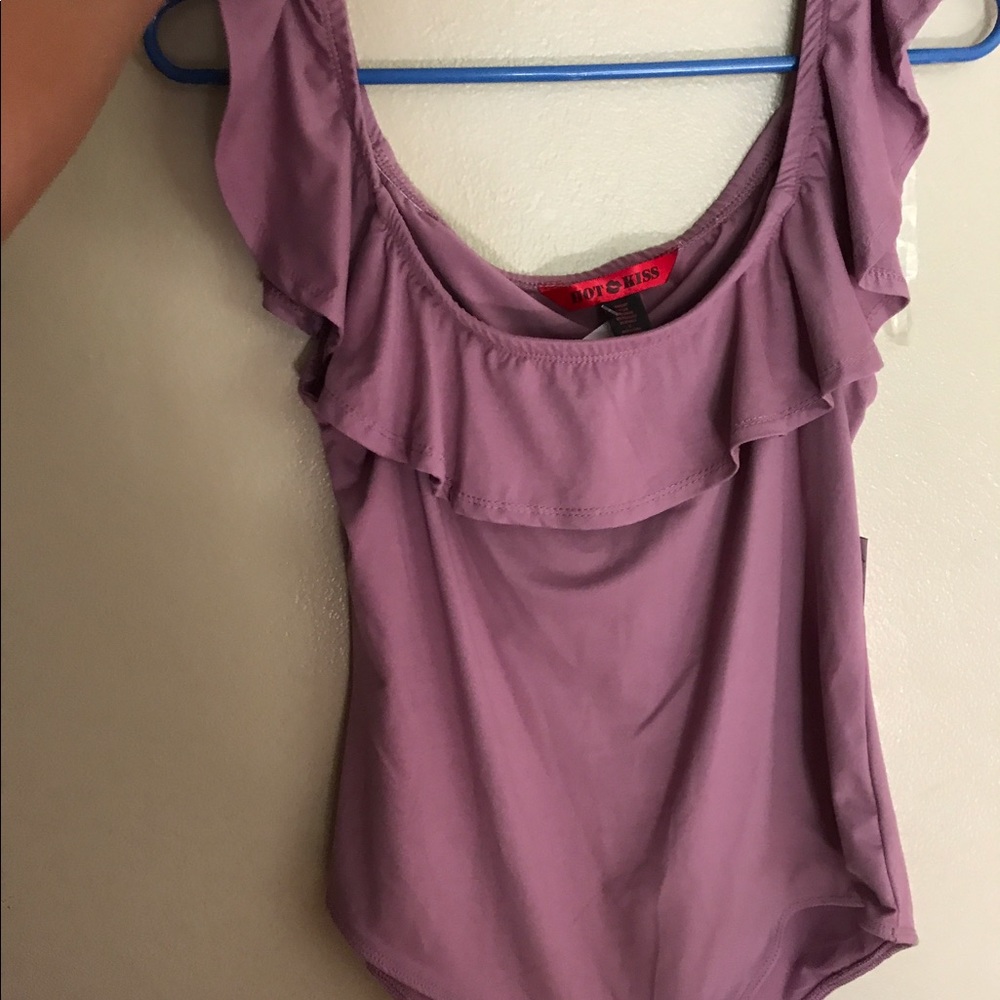 A Mauve off the shoulder bodysuit